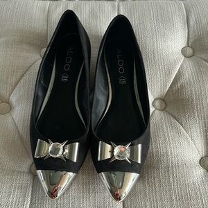 Aldo black suede pointed toe ballet flats with chrome tips and crystal.
